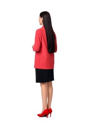 Woman in red jacket and black dress on white background