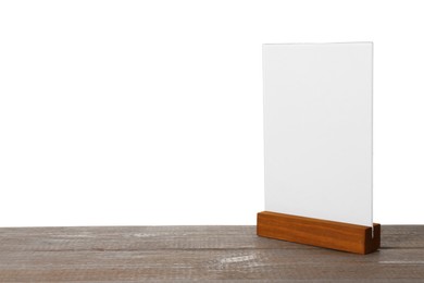 Photo of Menu holder on wooden table against white background. Mockup for design