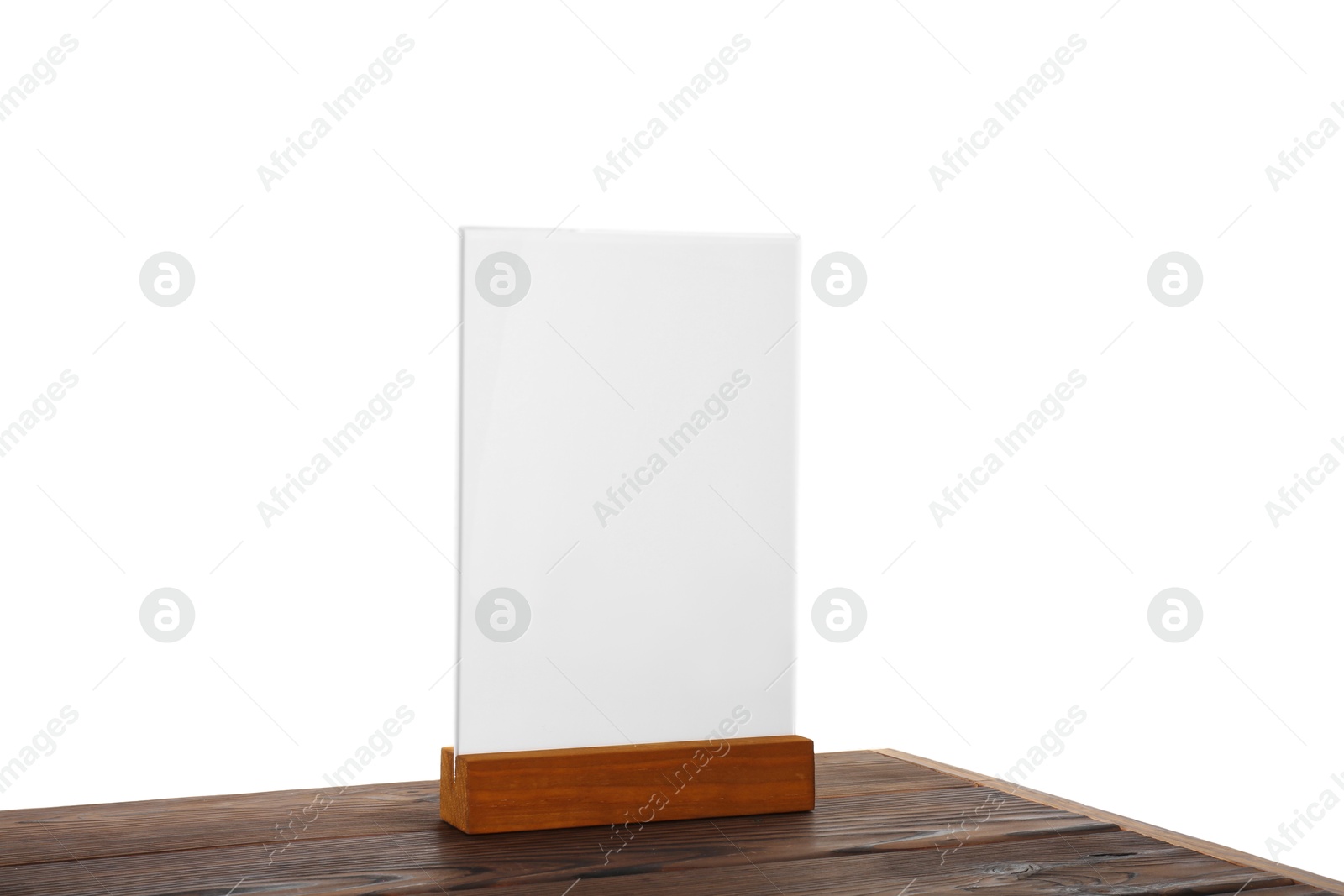 Photo of Menu holder on wooden table against white background. Mockup for design