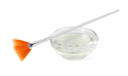 Photo of Bowl of chemical peel and brush isolated on white. Peeling procedure