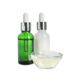 Photo of Bottles and bowl of chemical peel isolated on white. Peeling procedure