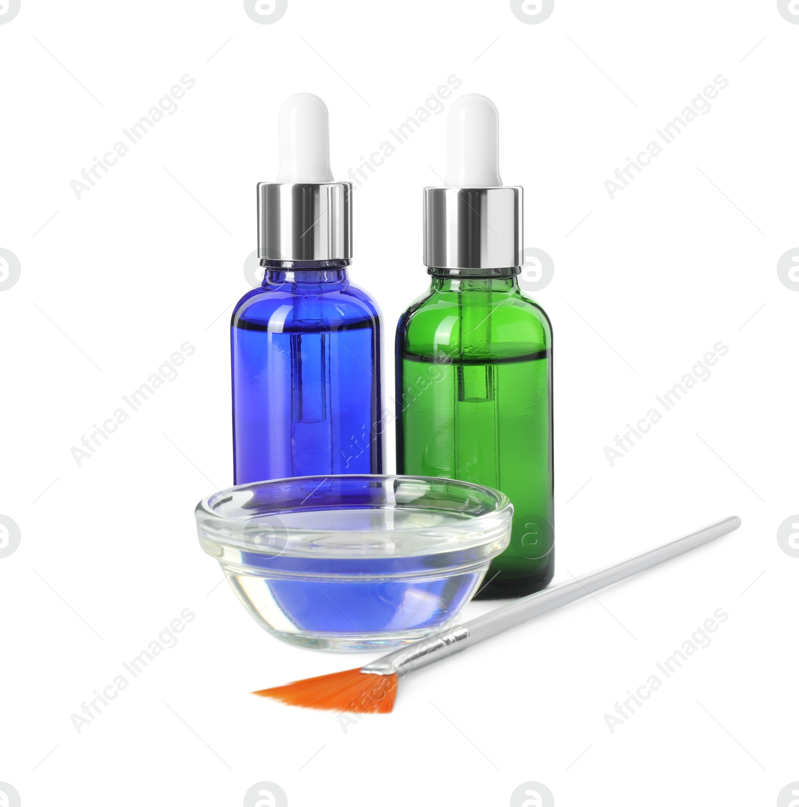 Photo of Bottles of chemical peel, bowl with liquid and brush isolated on white. Peeling procedure