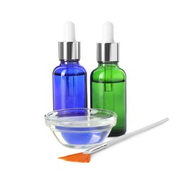 Photo of Bottles of chemical peel, bowl with liquid and brush isolated on white. Peeling procedure