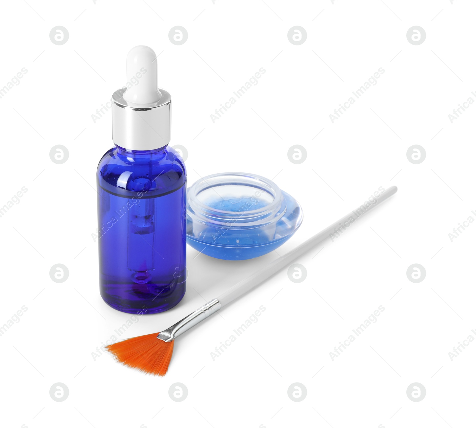 Photo of Bottle of chemical peel, bowl with liquid and brush isolated on white. Peeling procedure