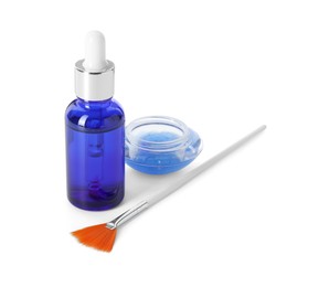 Bottle of chemical peel, bowl with liquid and brush isolated on white. Peeling procedure