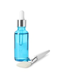 Photo of Bottle of chemical peel and brush isolated on white. Peeling procedure