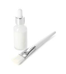 Bottle of chemical peel and brush isolated on white. Peeling procedure