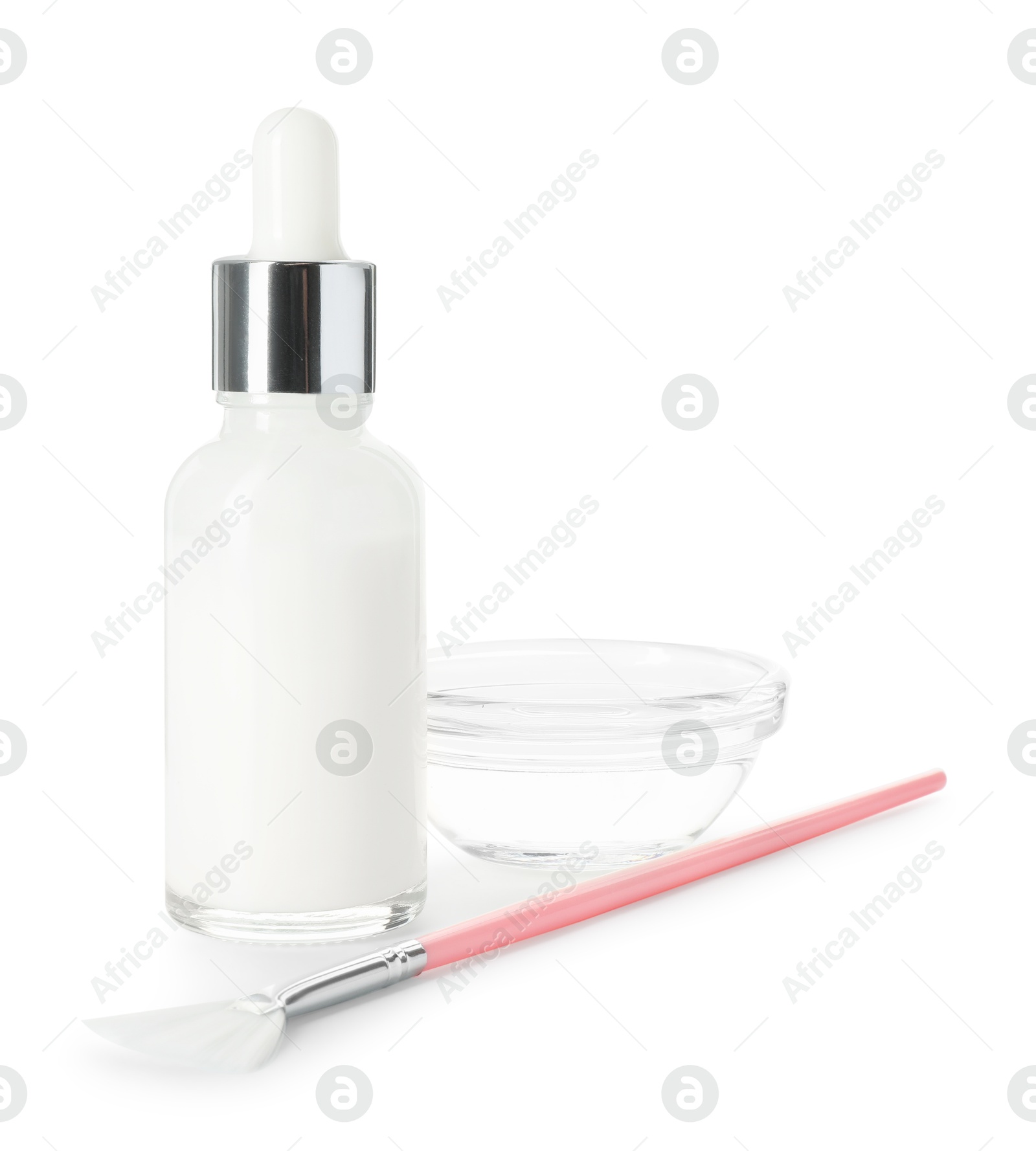 Photo of Bottle of chemical peel, bowl with liquid and brush isolated on white. Peeling procedure