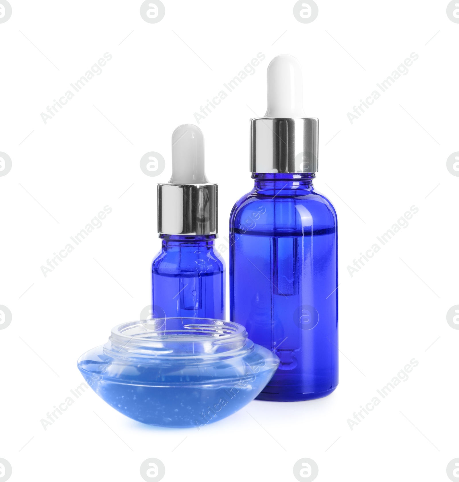 Photo of Bottles of chemical peel and bowl with liquid isolated on white. Peeling procedure