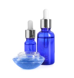 Photo of Bottles of chemical peel and bowl with liquid isolated on white. Peeling procedure