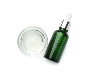 Bottle of chemical peel and bowl with liquid isolated on white, top view. Peeling procedure