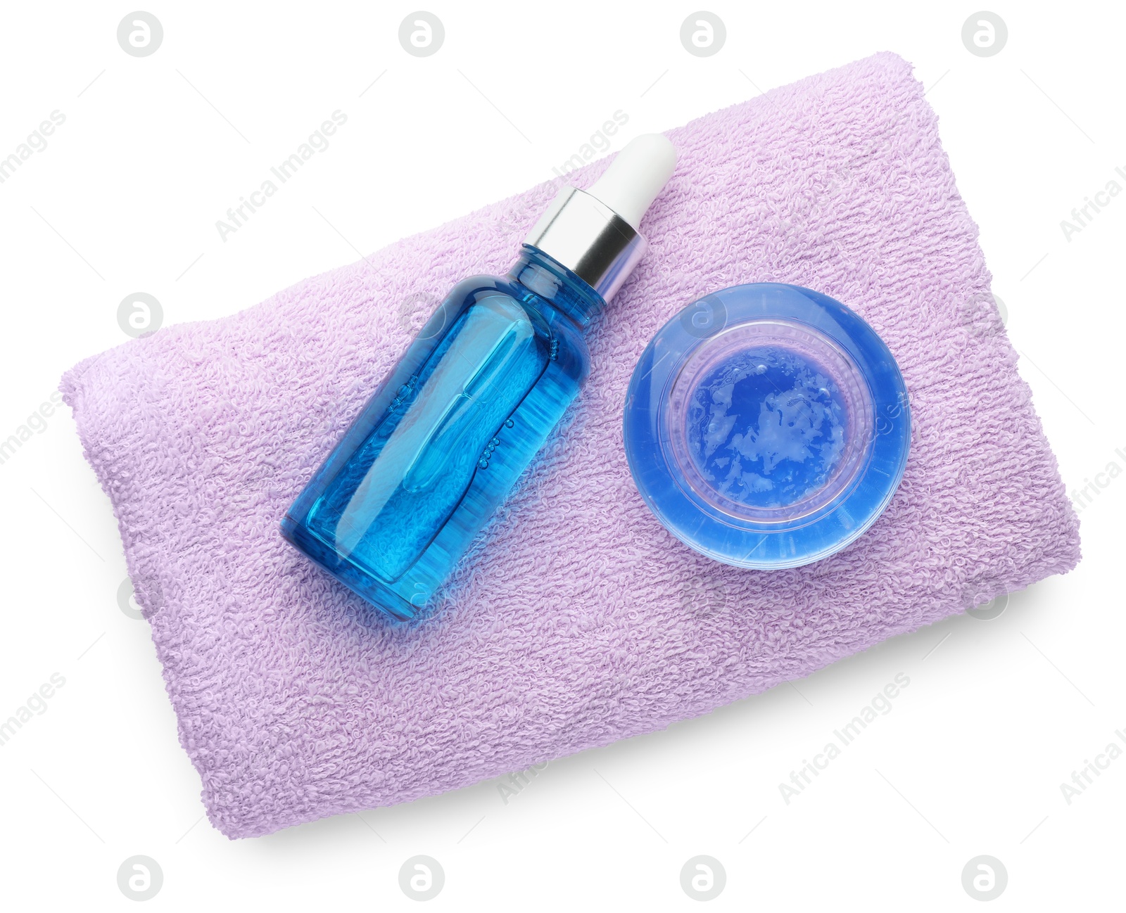 Photo of Bottle of chemical peel, bowl with liquid and soft towel isolated on white, top view. Peeling procedure