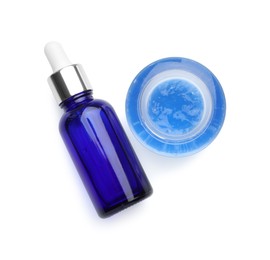 Photo of Bottle and bowl of chemical peel isolated on white, top view. Peeling procedure