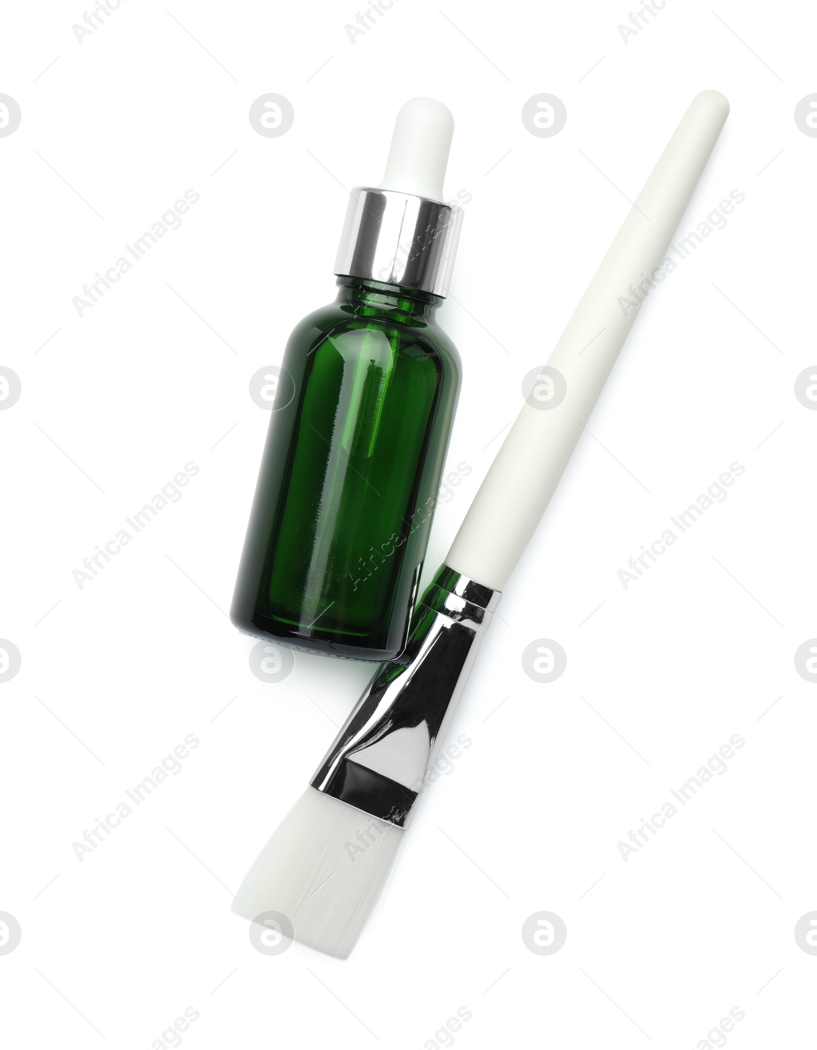 Photo of Bottle of chemical peel and brush isolated on white, top view. Peeling procedure