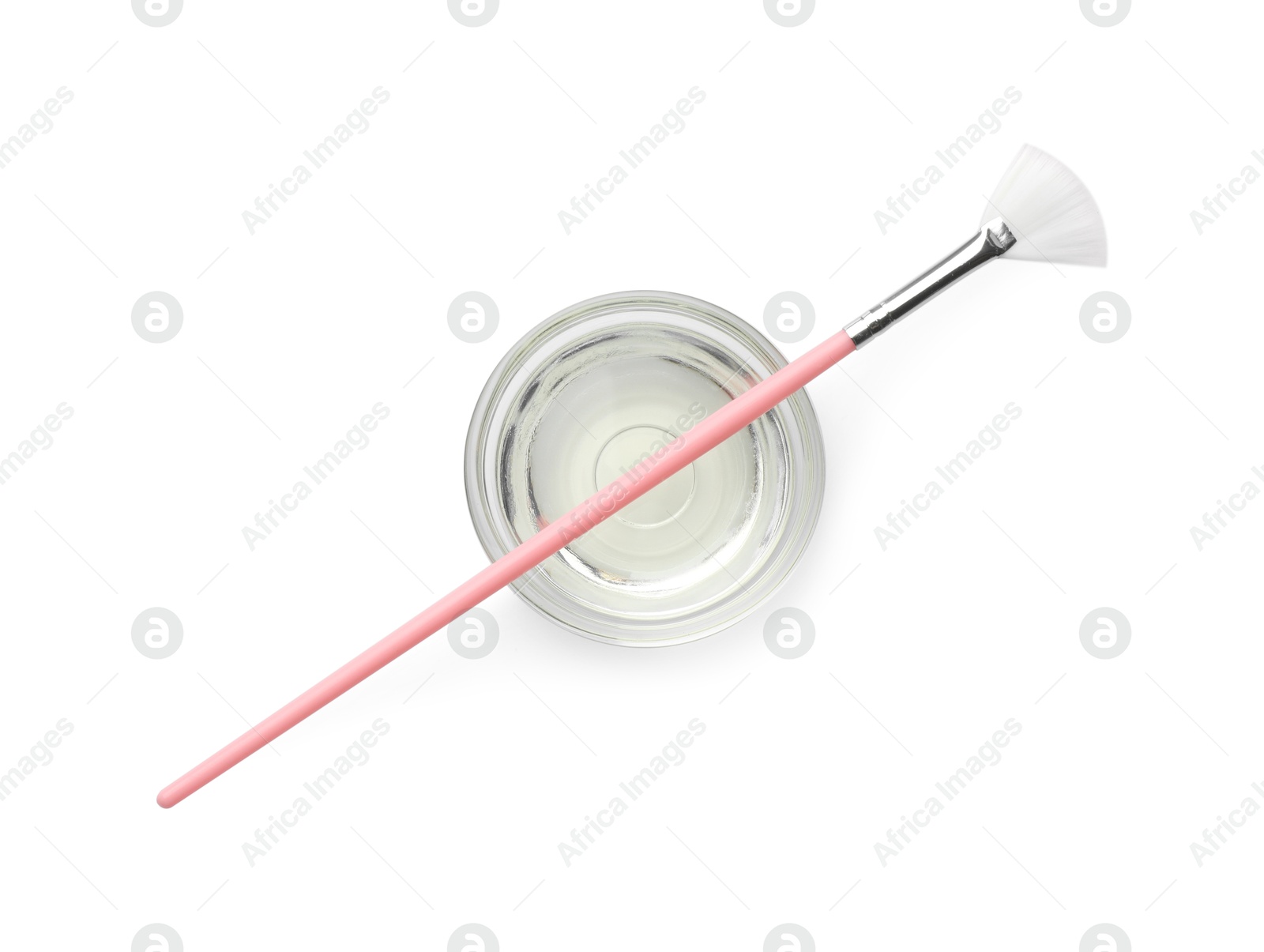 Photo of Bowl of chemical peel and brush isolated on white, top view. Peeling procedure