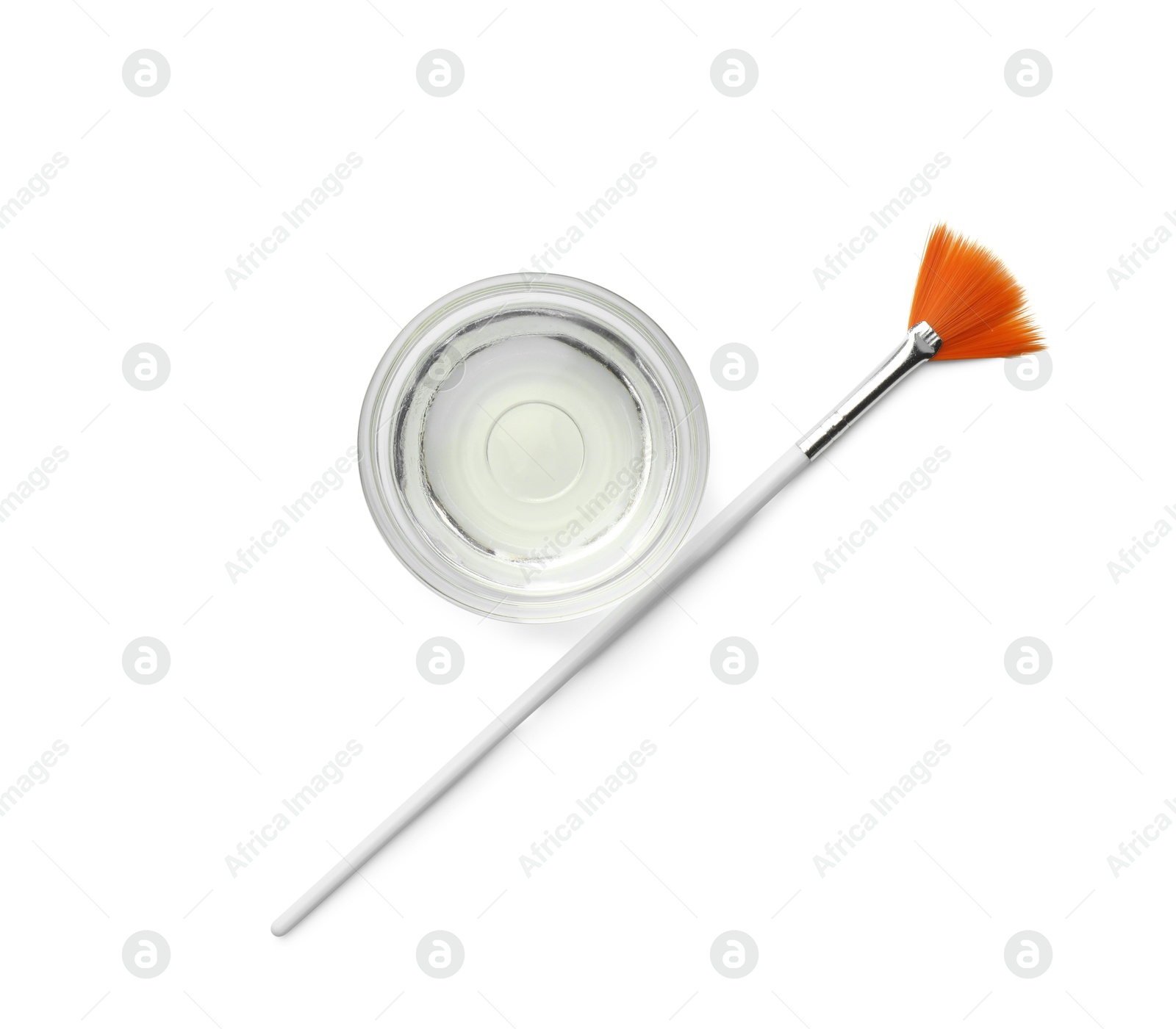 Photo of Bowl of chemical peel and brush isolated on white, top view. Peeling procedure