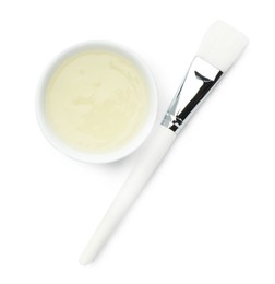 Photo of Bowl of chemical peel and brush isolated on white, top view. Peeling procedure