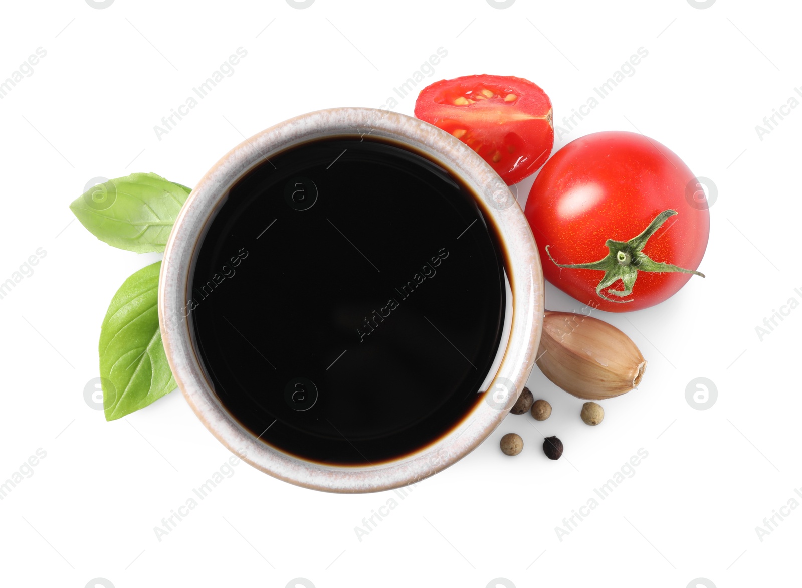 Photo of Delicious balsamic vinegar, basil , tomatoes, garlic and peppercorns isolated on white, top view