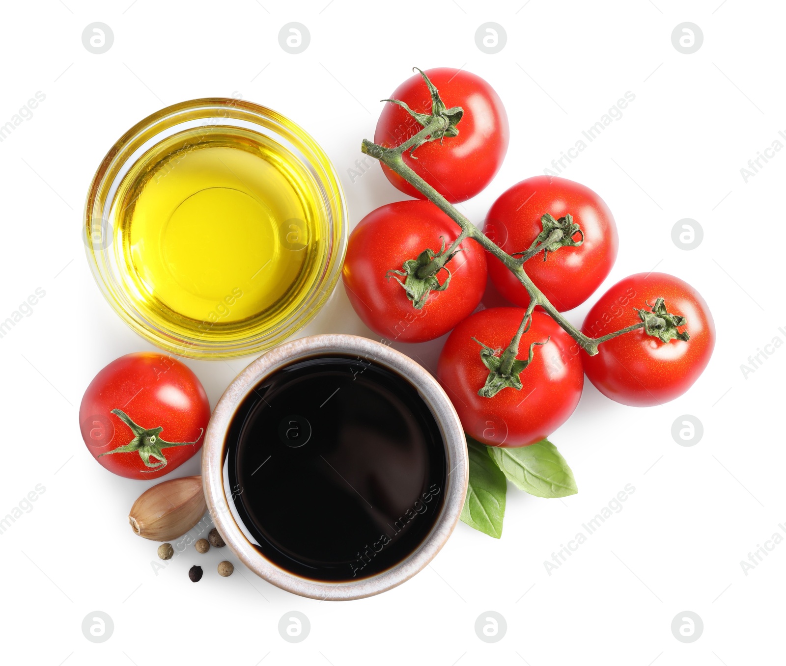 Photo of Delicious balsamic vinegar, olive oil, tomatoes and spices isolated on white, top view