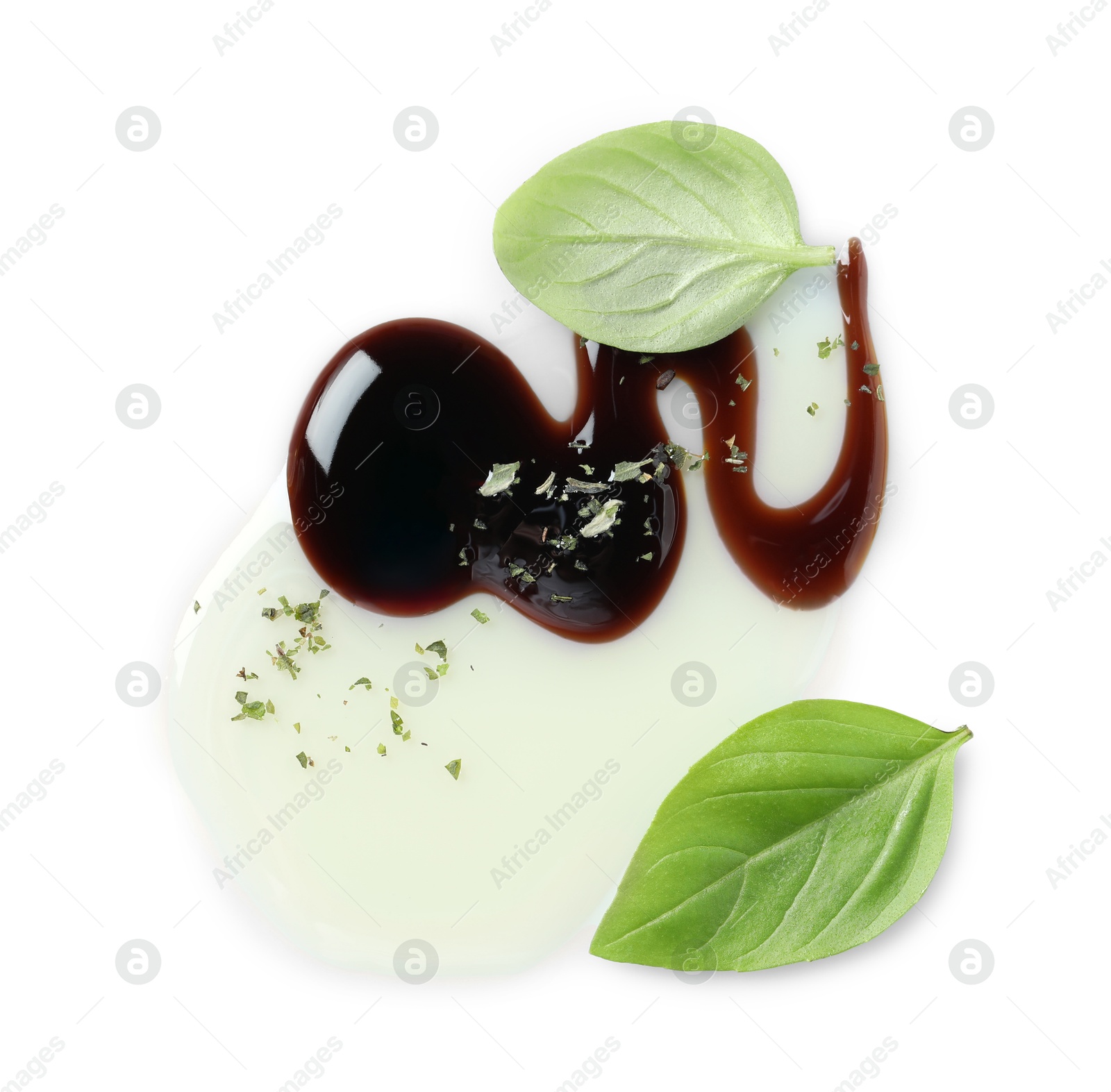 Photo of Delicious balsamic vinegar with olive oil, basil and herbs isolated on white, top view