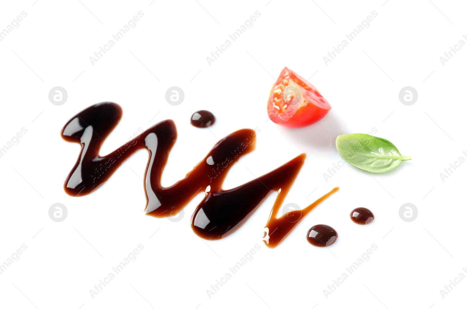 Photo of Delicious balsamic vinegar, cut tomato and basil isolated on white