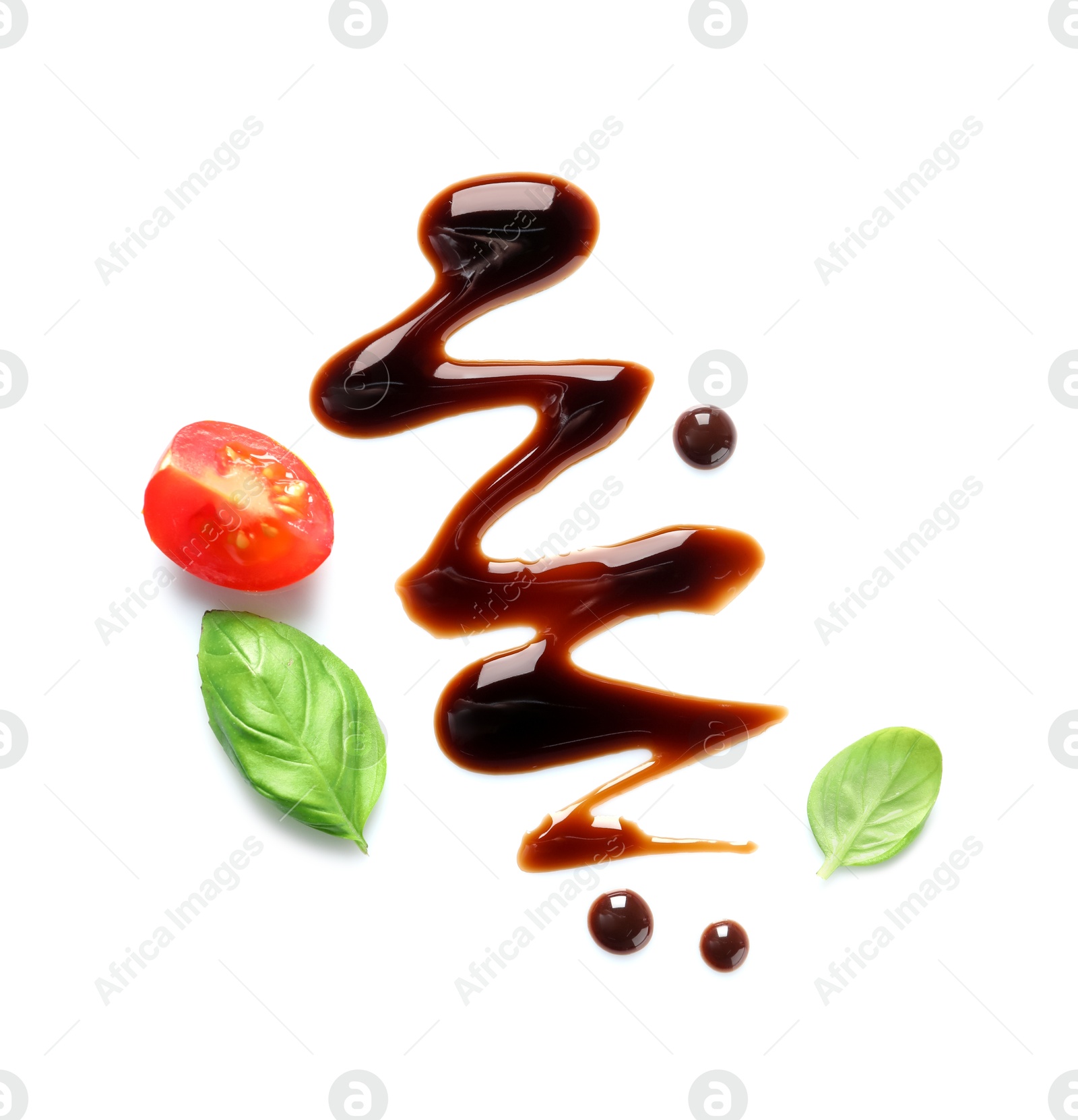 Photo of Delicious balsamic vinegar, cut tomato and basil isolated on white, top view