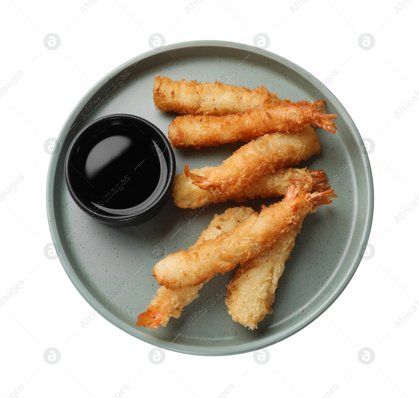 Photo of Tasty breaded fried shrimps and sauce isolated on white, top view