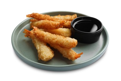 Tasty breaded fried shrimps and sauce isolated on white