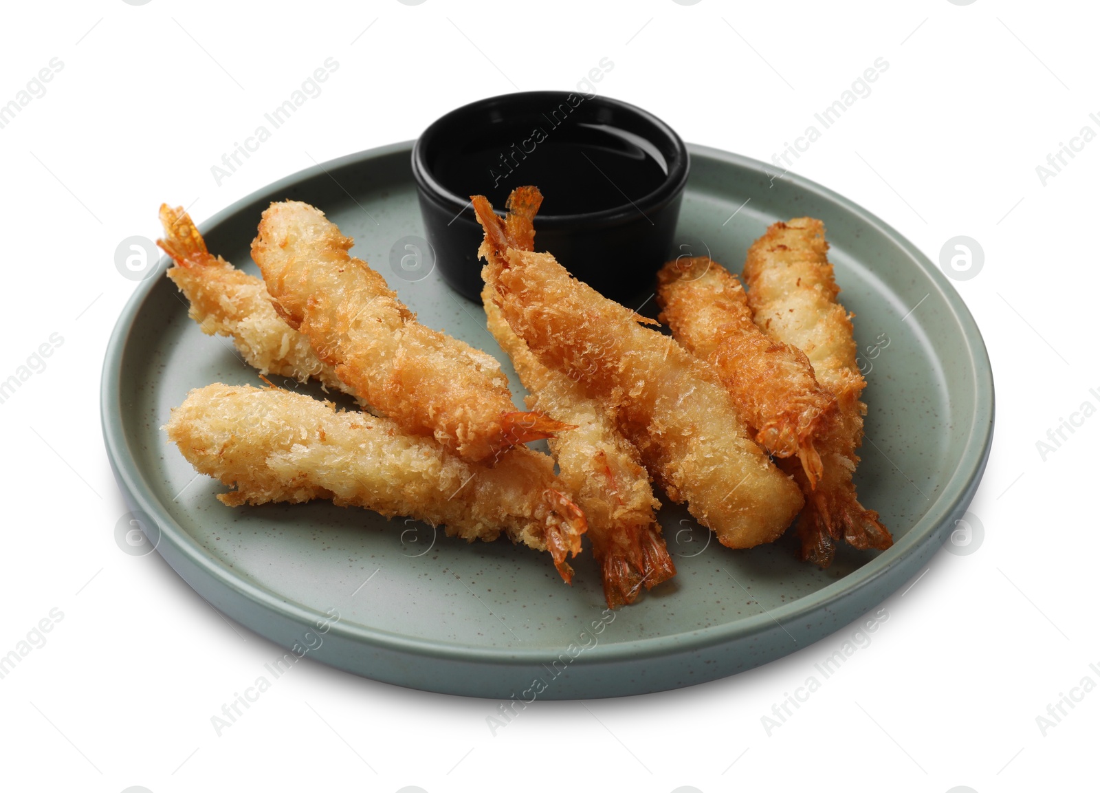 Photo of Tasty breaded fried shrimps and sauce isolated on white