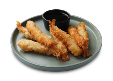 Photo of Tasty breaded fried shrimps and sauce isolated on white