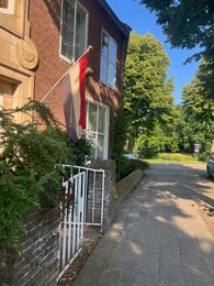Photo of Walkway near house with flag of Netherlands