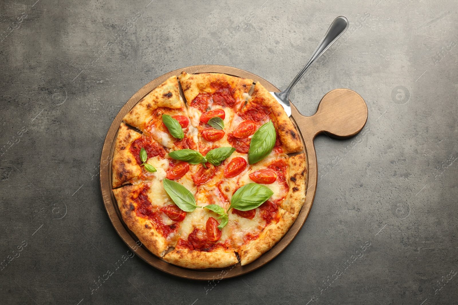 Photo of Delicious Margherita pizza on grey table, top view