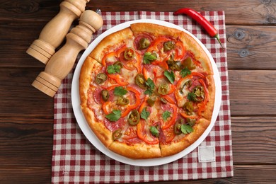 Photo of Delicious pizza Diablo on wooden table, top view