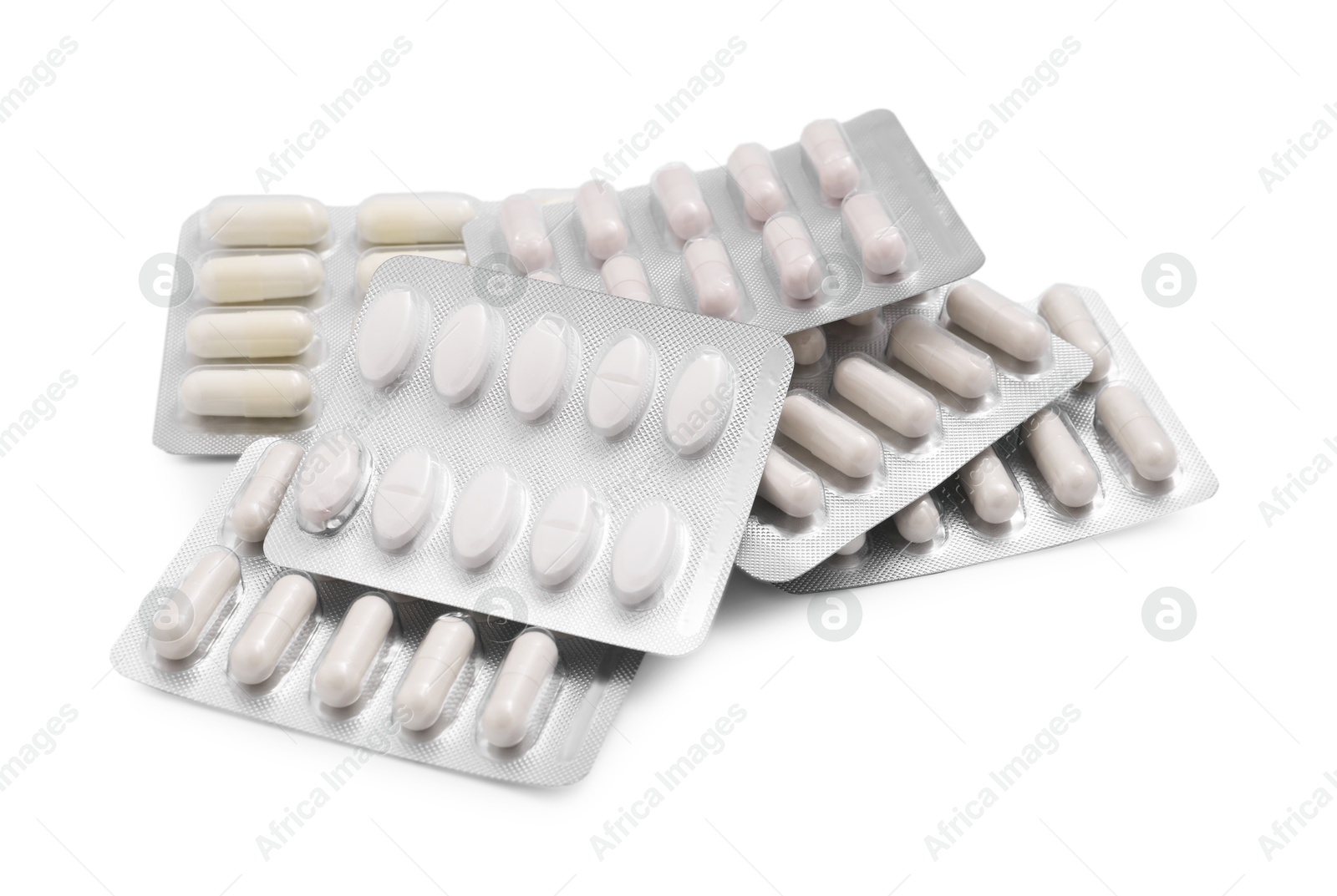 Photo of Different antibiotic pills in blisters isolated on white