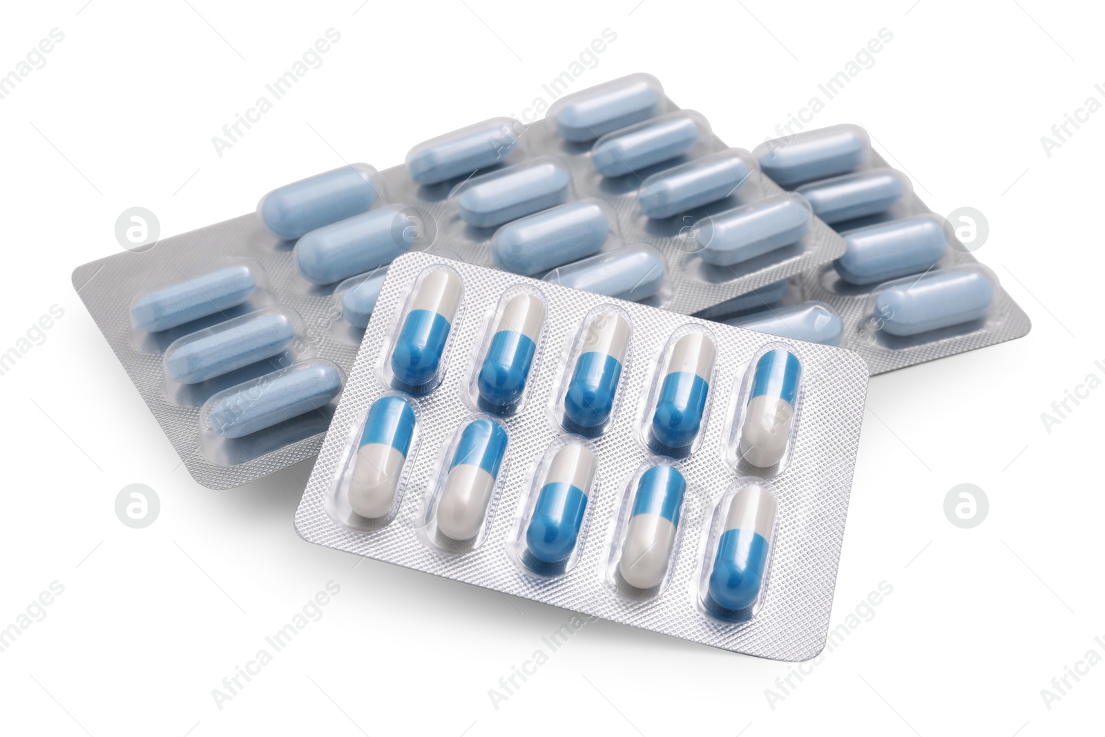 Photo of Different antibiotic pills in blisters isolated on white