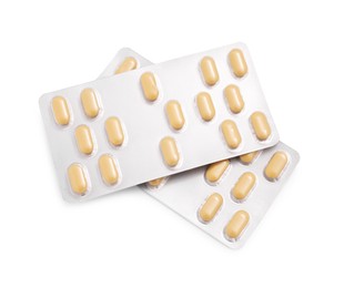 Antibiotic pills in blisters isolated on white, top view