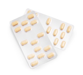 Antibiotic pills in blisters isolated on white, top view