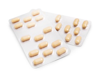 Photo of Antibiotic pills in blisters isolated on white