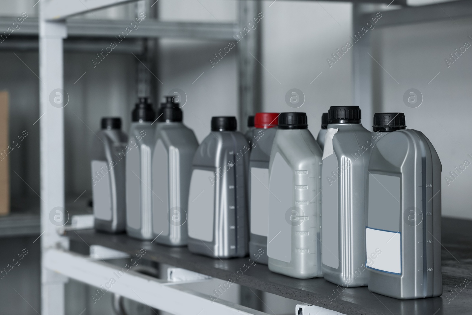 Photo of Containers with motor oils in auto store