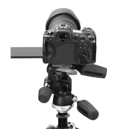 Modern camera with tripod isolated on white. Photographer's equipment