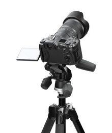 Modern camera with tripod isolated on white. Photographer's equipment