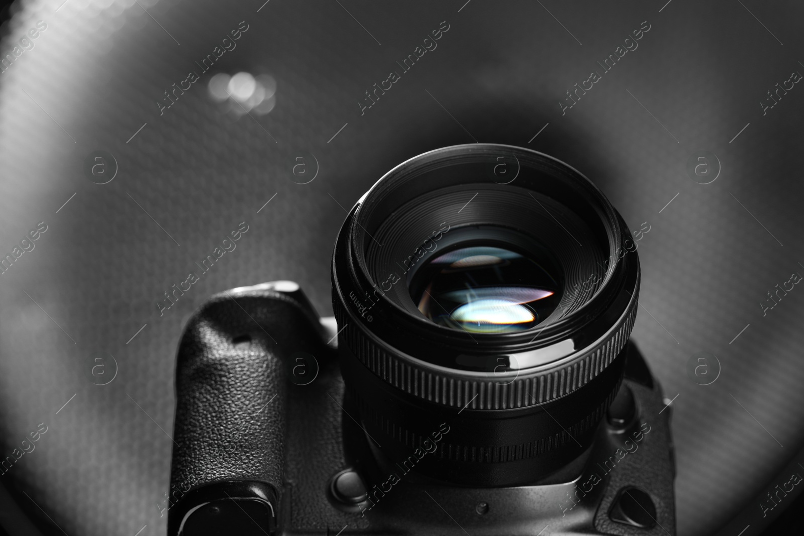 Photo of One modern photo camera on blurred background, closeup