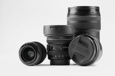 Camera lens on white background. Photographer's equipment