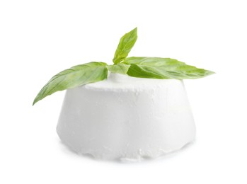 Photo of Fresh ricotta (cream cheese) and basil isolated on white