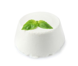 Fresh ricotta (cream cheese) and basil isolated on white