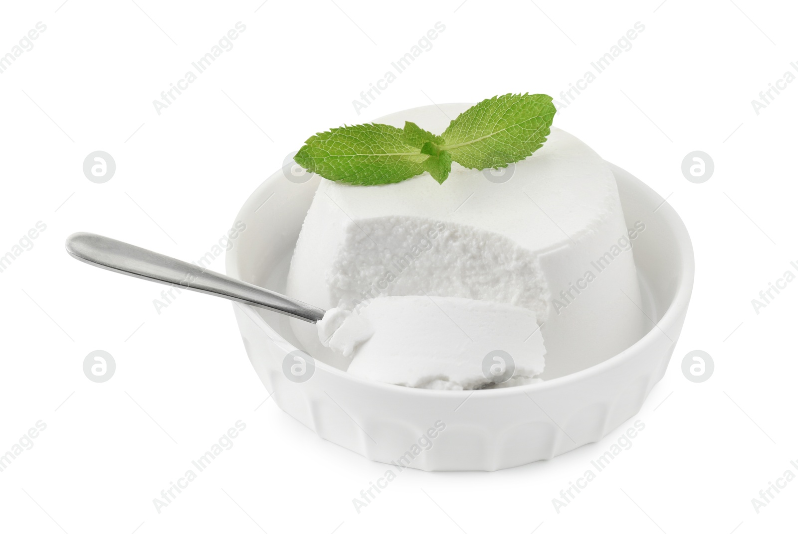 Photo of Delicious ricotta cheese, mint and spoon in bowl isolated on white