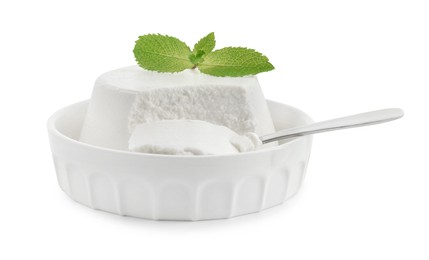 Photo of Delicious ricotta cheese, mint and spoon in bowl isolated on white