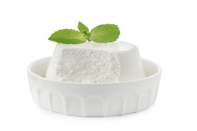 Photo of Delicious ricotta cheese and mint in bowl isolated on white