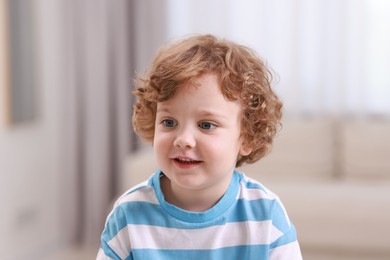 Portrait of little boy indoors. Cute child