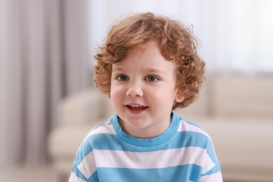 Portrait of little boy indoors. Cute child